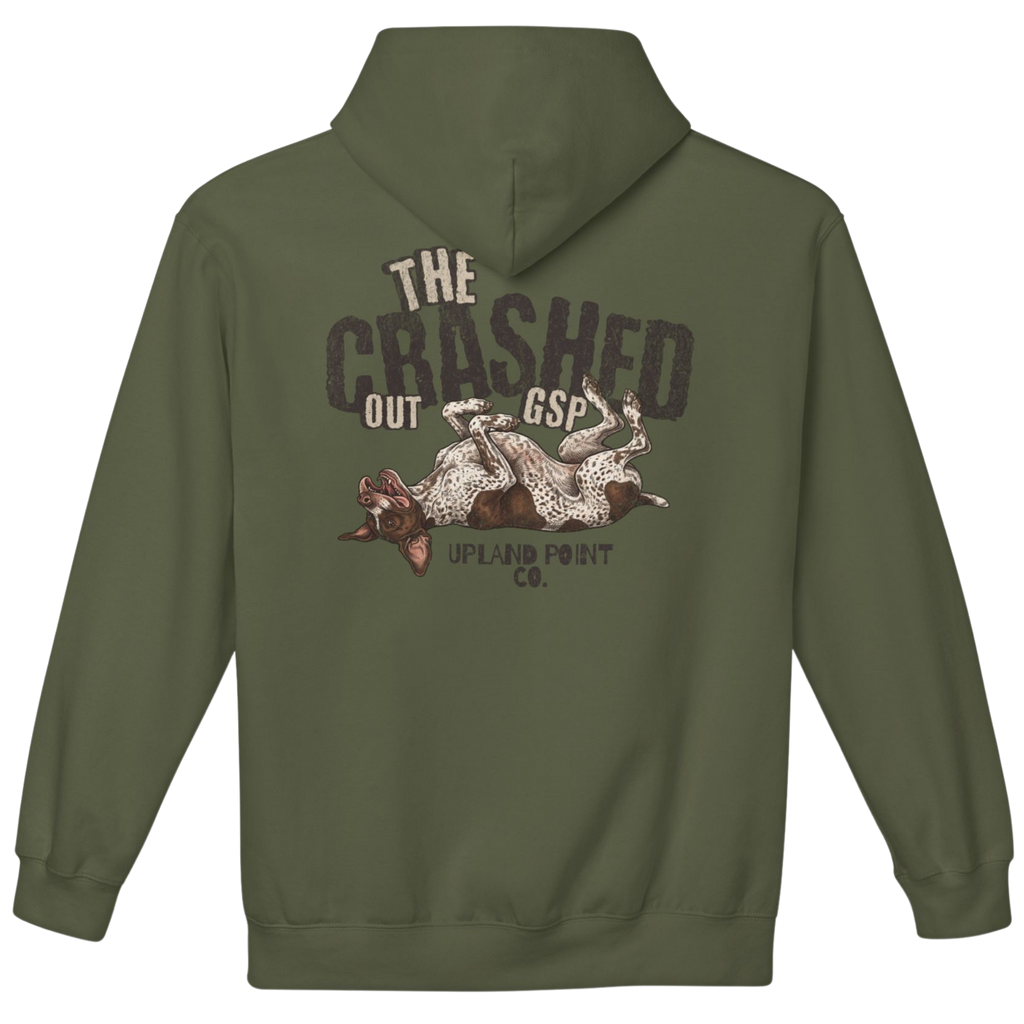 An military green pullover hoodie shown from the back, featuring a distressed graphic print with the text 'THE CRASHED OUT GSP' and 'UPLAND POINT CO.' above an illustration of a dog lying on the ground.