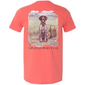 A coral short-sleeve t-shirt showing the back graphic, which features a detailed illustration of a black and white spotted dog holding a green ball next to a pickleball paddle and basket filled with pickleballs, with the text 'UPLAND POINT CO.' printed below